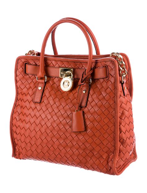 michael kors woven handbags